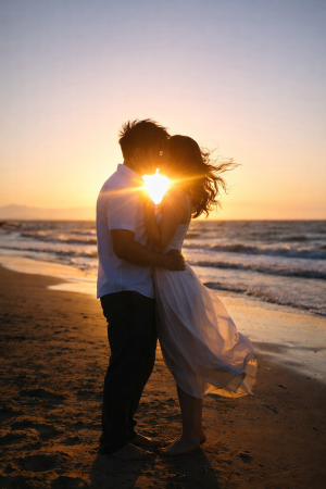 Romantic Couple Kissing Silhouette on Beach at Sunset Mobile Wallpaper