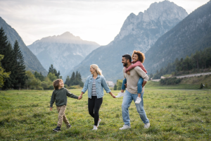 Happy Family Hiking in Mountains Free 4K Nature Desktop Wallpaper