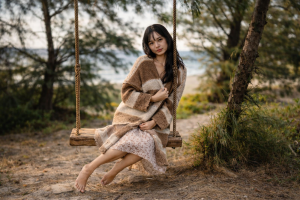 Beautiful Girl Sitting on a Swing in Nature - Free 4K Desktop Background