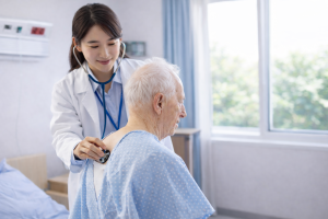 Doctor Checking Elderly Patient's Heartbeat in Hospital - Free Medical Wallpaper for Desktop