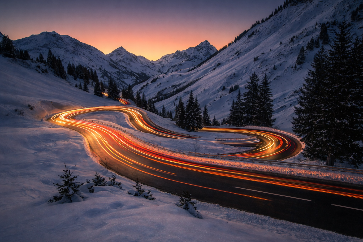 Snowy Mountain Road at Sunset with Glowing Car Lights 4K Ultra HD Desktop Background