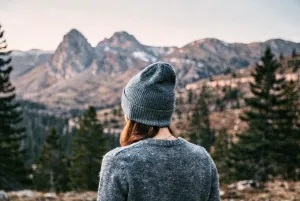 Beautiful Mountain Landscape with Person in Grey Beanie - Free 4K Desktop Background
